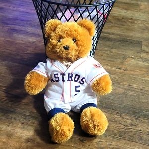 Teddy bear in Astos uniform.